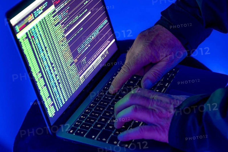 Symbolic image cyber attack, computer crime, cybercrime, computer hackers attack a network, computer, IT infrastructure