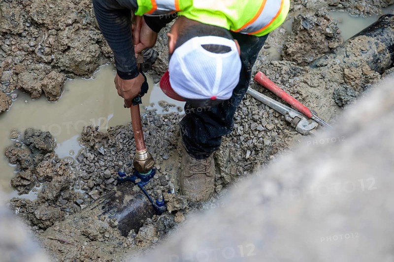 Detroit, Michigan, A new copper pipe is connected to the underground water main as workers replace old lead water service lines. Lead is harmful to health, especially in children. The city of Detroit estimates there are 80, 000 homes in the city with lead service lines and has begun a program to replace them all