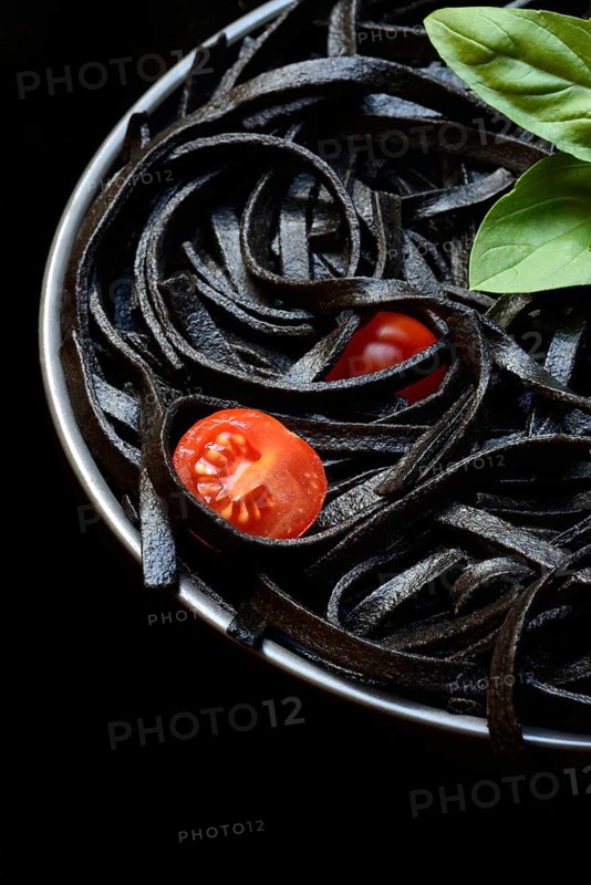 Black pasta coloured with squid ink on a plate, Taglioni al Nero di Seppia, Italy, Europe