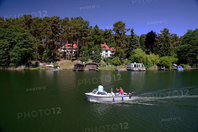 Europe, Germany, Mecklenburg-Western Pomerania, Elde-Müritz Waterway off Waren, Villas on the shore, Waren, Mecklenburg-Western Pomerania, Germany, Europe