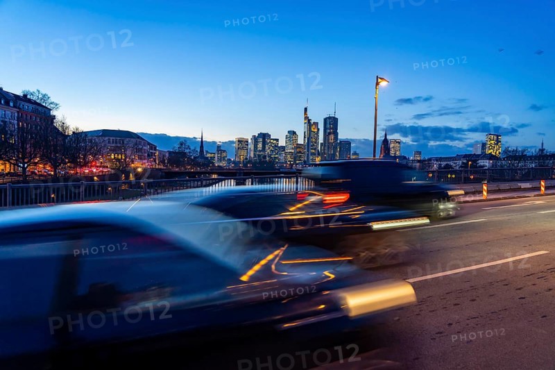 Skyline of the city centre of Frankfurt am Main, road traffic, car, on the raft bridge, dusk, river Main, winter, Hesse, Germany, Europe