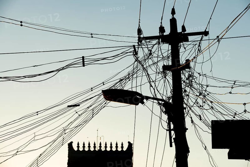 High-voltage power lines, tangle of cables, temple gopura or temple tower, Rameswaram or Rameshwaram, Pamban Island, Tamil Nadu, India, Asia