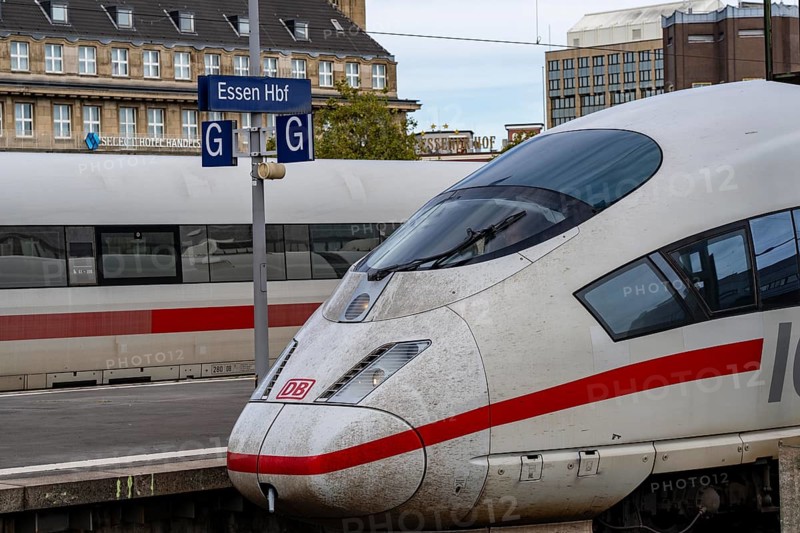 Essen main station, ICE trains on the tracks, in the background the Handelshof, city centre of Essen, North Rhine-Westphalia, Germany, Europe