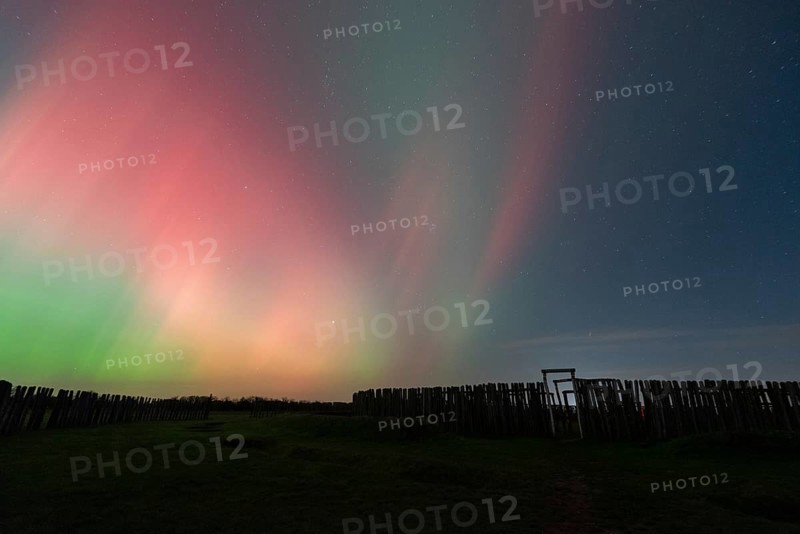 Northern lights (aurora borealis) over the ring sanctuary of Pömmelte, prehistoric circular ditch complex, also known by archaeologists as the German Stonehenge, Pömmelte, Saxony-Anhalt, Germany, Europe