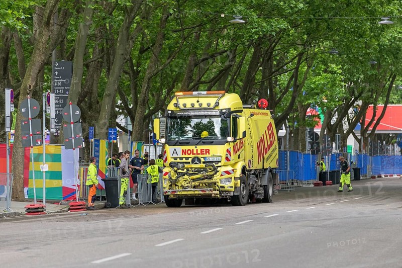 Sweeper cleans the road in front of the MHPArena in Stuttgart, Baden-Württemberg, Germany, Europe