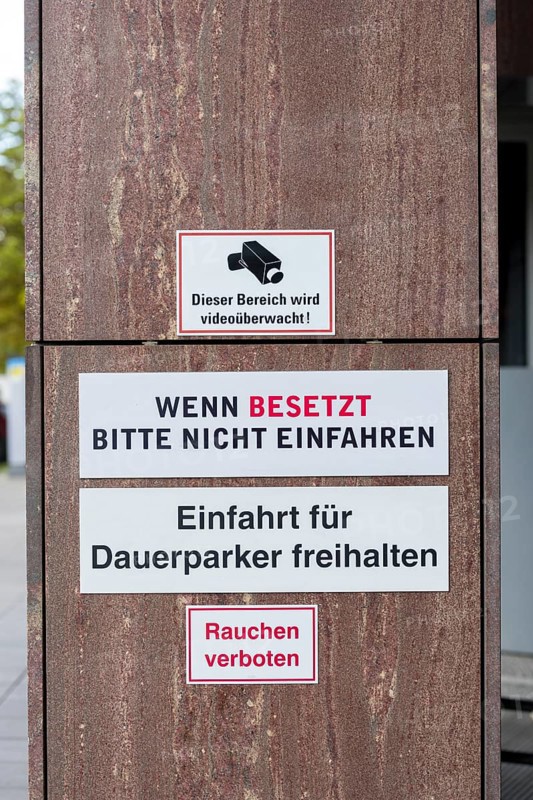 Signs with warnings about video surveillance and car park access in front of a building, no smoking, smoking ban, Baden-Württemberg, Germany, Europe