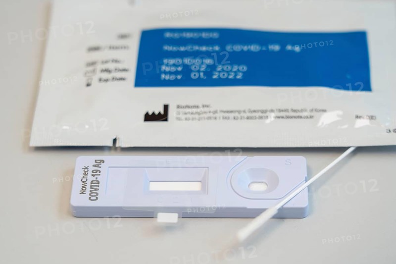 Covid-19 rapid test, antigen test, the abrasion of the swab is dissolved in a liquid and applied to the test device, after a few minutes the test device shows the result by a black line whether the person has tested positive or negative