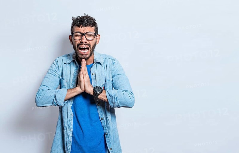 Man worried asking please, People putting hands together asking please, worried man apologizing, Hopeful man asking for help or apologizing, man thanking for forgiveness