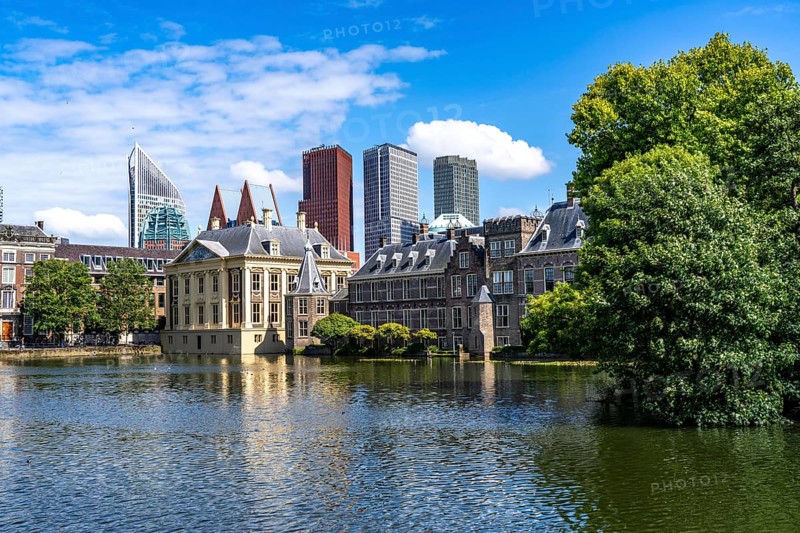 The Mauritshuis, historical art museum at the Binnenhof, seat of the Dutch government, Hofvijver pond, skyline of the city centre at the central station, in the city centre of The Hague, Netherlands