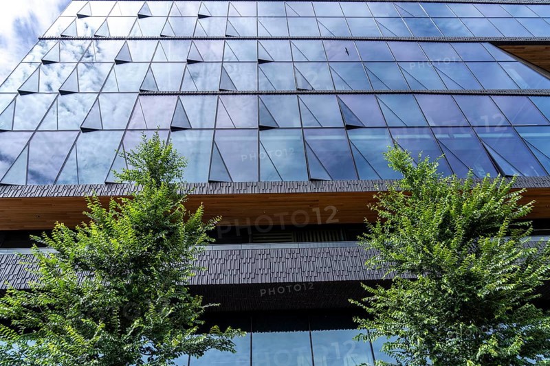 New corporate headquarters of Booking.com, online travel agency, hotel broker, building at Oosterdokseiland in the city centre of Amsterdam, Netherlands