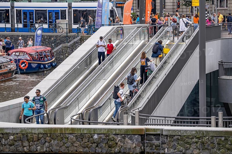 New bicycle car park at Amsterdam Central Station, Stationsplein, space for around 7000 bicycles, largest in Amsterdam, digitally monitored, underground, direct connection to the station and metro, Netherlands, escalators lead to the bicycle garage, Netherlands