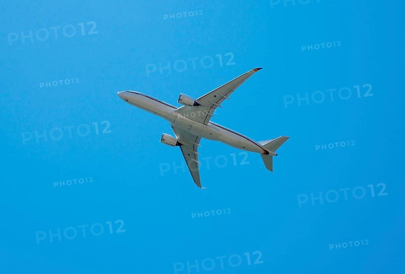 A large aircraft flies through a clear blue sky, Airbus A350 with the registration number 10 plus 02, aircraft of the Federal Ministry of Defence Air Wing, Faro, Algarve, Portugal, Europe