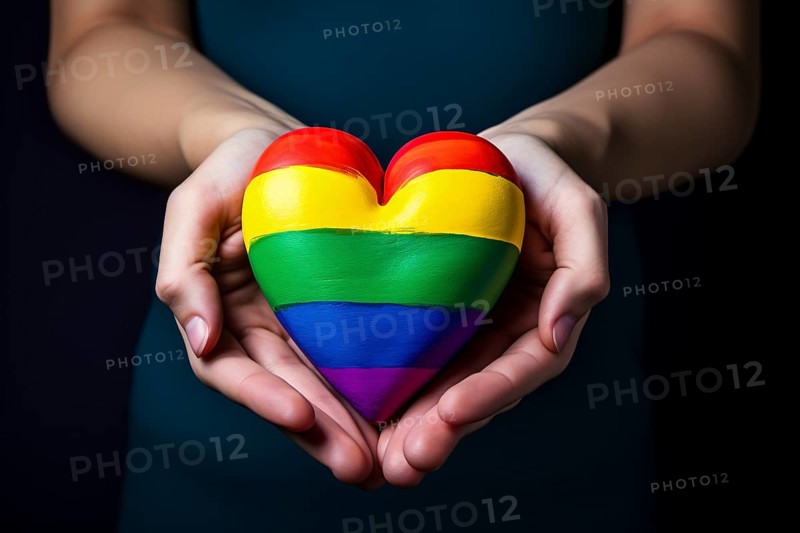 Hand holding heart with LGTB rainbow colors. KI generiert, generiert, AI generated