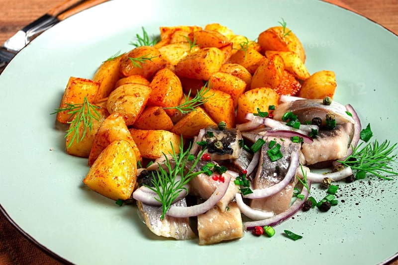 New potatoes, with pickled herring, and red onions, homemade, no people