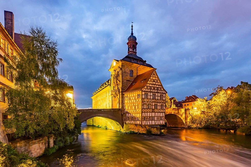 Old Town Hall on an artificial island in the River Regnitz. The landmark can be reached via two arched bridges. Night shot. City view of Bamberg, Upper Franconia, Bavaria, Germany, Europe