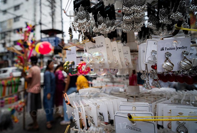 Women buys jewelleries at street market ahead of Durga Puja festival on October 7, 2024 in Guwahati, India. Shopping ahead of Durga Puja is a major event, as people prepare for the celebration