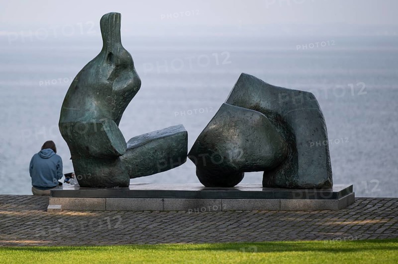 Sculpture Reclining Figure No. 5 by Henry Moore, sculpture park, visitors, Louisiana Museum of Modern Art, Humlebæk, Nivå Bugt, Hovedstaden, Øresund coast, Denmark, Europe
