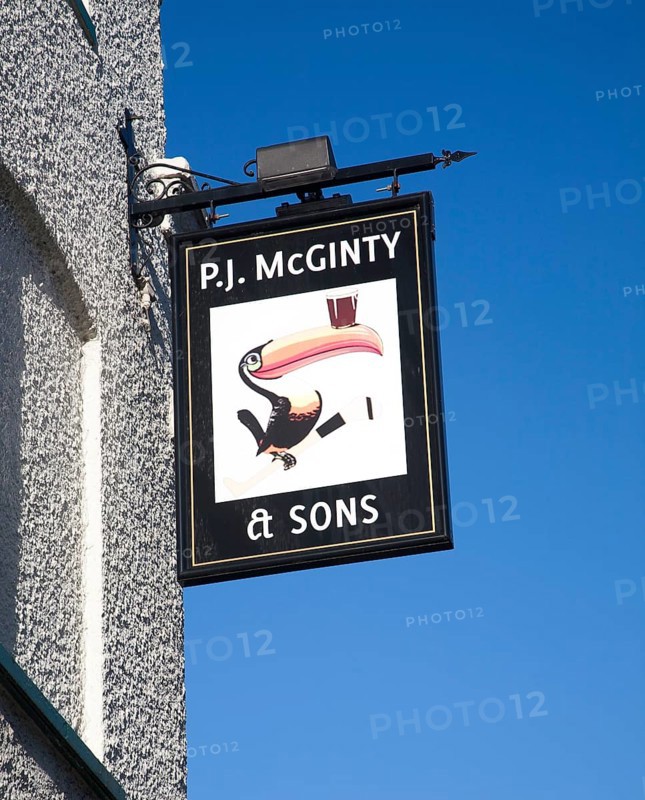 P.J McGinty Irish pub with toucan bird Guinness sign against blue sky, Ipswich, Suffolk, England, United Kingdom, Europe