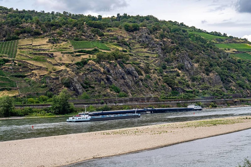 Cargo ship, tanker, on the Rhine in the Upper Middle Rhine Valley, sandbank in the Rhine, due to low water level, near Oberwesel, Rhineland-Palatinate, Germany, Europe