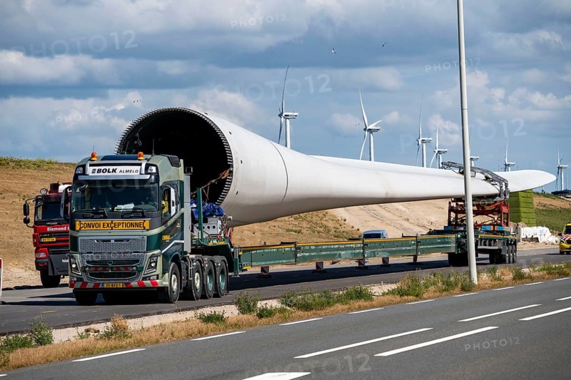 Wind farm under construction, on Maasvlakte 2, new part of the port of Rotterdam, 22 onshore wind turbines are being erected there on the coastline, the artificial island, type Eneco, transport of a rotor, Netherlands