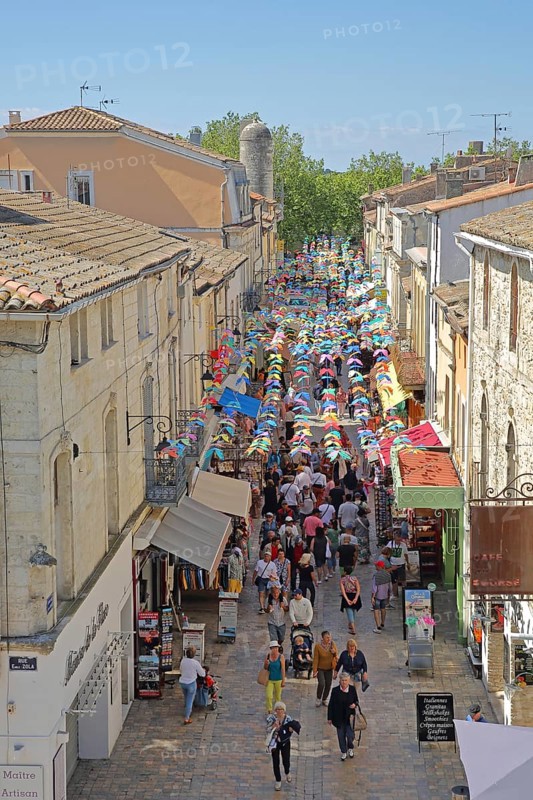 People on the Grand Rue Jean Jaurès and decoration with pennant chain, tourists, strolling, shopping, shop, shops, Jaures, crowd, view from above, Aigues-Mortes, Gard, Camargue, Provence, France, Europe