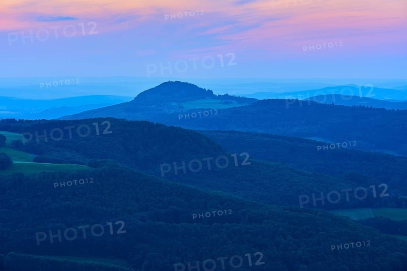 A calming mountain landscape at dusk with soft blue tones and a romantic horizon, Milseburg, Abtsroder Kuppe, Abtsroda, Rhön, Hesse, Germany, Europe
