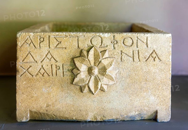 Hellenistic Greek limestone urn with rosette emblem and transcription, archaeology museum Apollonia Archaeological Park, Albania 3rd-2nd century BC