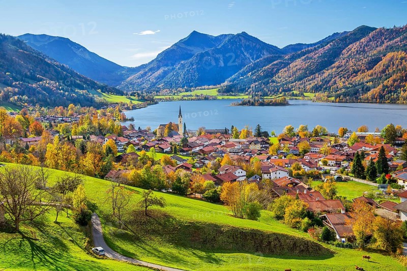 Panorama of the village and lake with the parish church of St. Sixtus and the Brecherspitz 1683m in the Mangfall mountains in autumn, Schliersee, Upper Bavaria, Bavaria, Germany, Europe