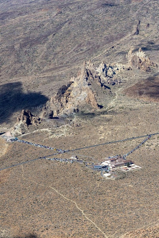 Panorama during the ascent to Alto de Guajara, 2715m, to the bizarrely shaped rock formations of volcanic rock, Roques de García, the visitor centre and the Hotel Parador, at sunrise, Teide National Park, Parque Nacional del Teide, Tenerife, Canary Islands, Spain, Europe