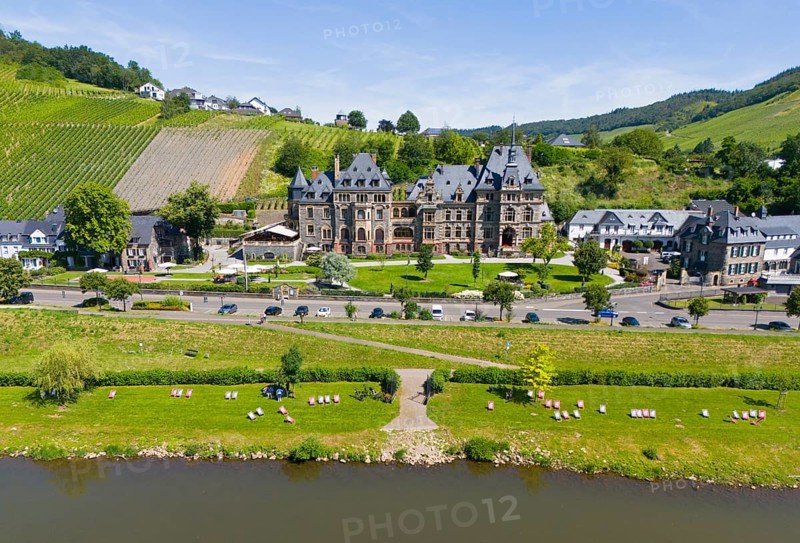 Historic castle surrounded by vineyards and river landscape on a sunny day, aerial view, Lieser Castle, Lieser, Moselle, Bernkastel-Kues, Rhineland-Palatinate, Germany, Europe