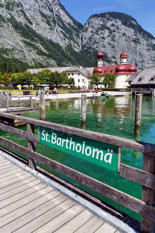 Pilgrimage church St. Bartholomä am Königssee with inscription on the jetty, Berchtesgaden National Park, Berchtesgadener Land, Upper Bavaria, Bavaria, Germany, Europe