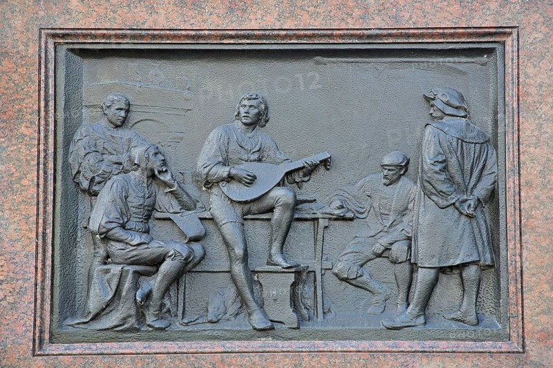 Relief with life story of Martin Luther, life as a student, musician, guitar, figures, history, scene, biography, Martin Luther monument, Luther monument, Erfurt, Thuringia, Germany, Europe
