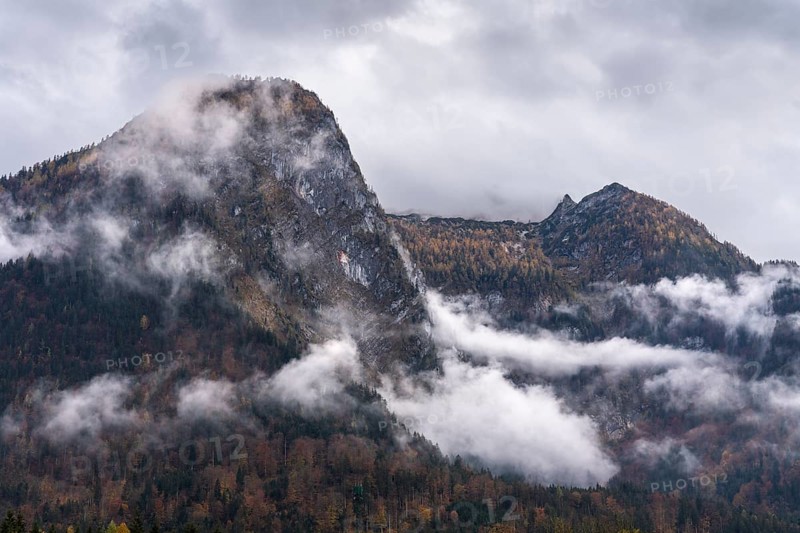 View of part of the Tennengebirge from Oberscheffau. The mountains are covered in clouds. Autumn. Salzburger Land, Upper Austria, Austria, Europe