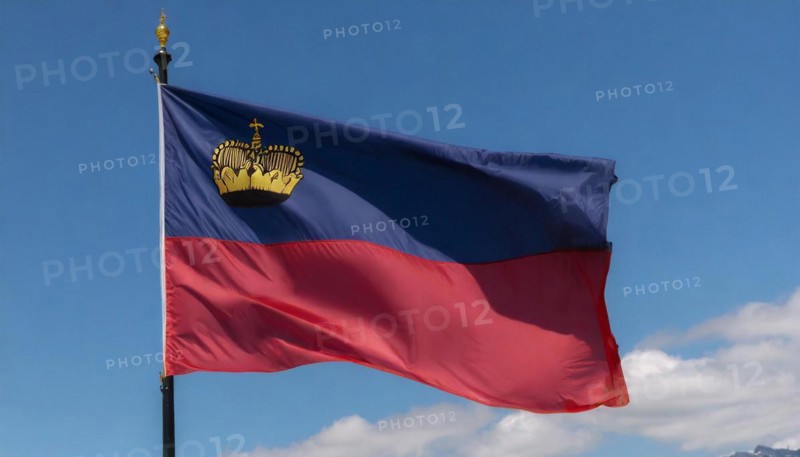 The flag of Liechtenstein flutters in the wind
