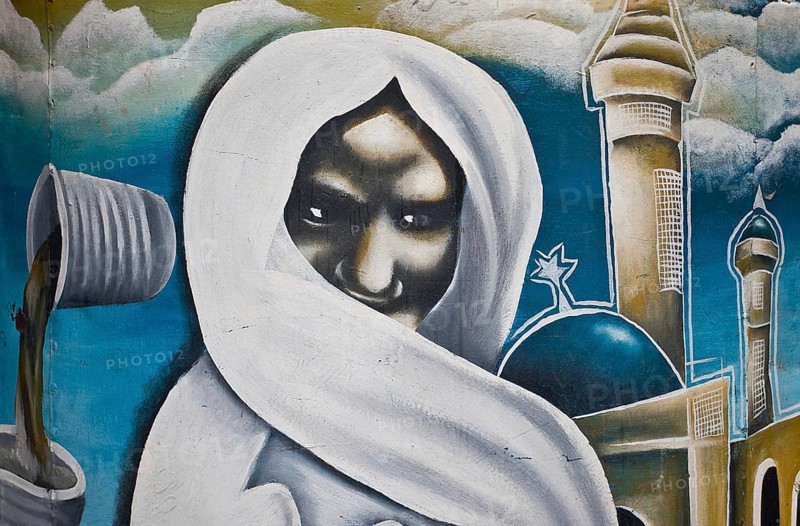 Painting representing the senegalese muslim leader Ahmadou Bamba (19th century) . On the left side, two cups of Touba coffee he popularized in Senegal. Touba coffee is coffee mixed with cloves