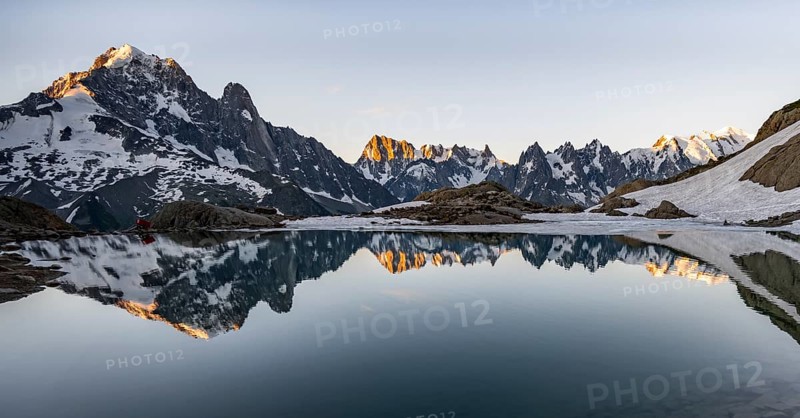 Morning atmosphere at a mountain lake, mountain landscape at sunrise, water reflection in Lac Blanc, mountain peak, Aiguille Verte, Grandes Jorasses, Aiguille du Moine, Mont Blanc, Mont Blanc massif, Chamonix-Mont-Blanc, Haute-Savoie, France, Europe