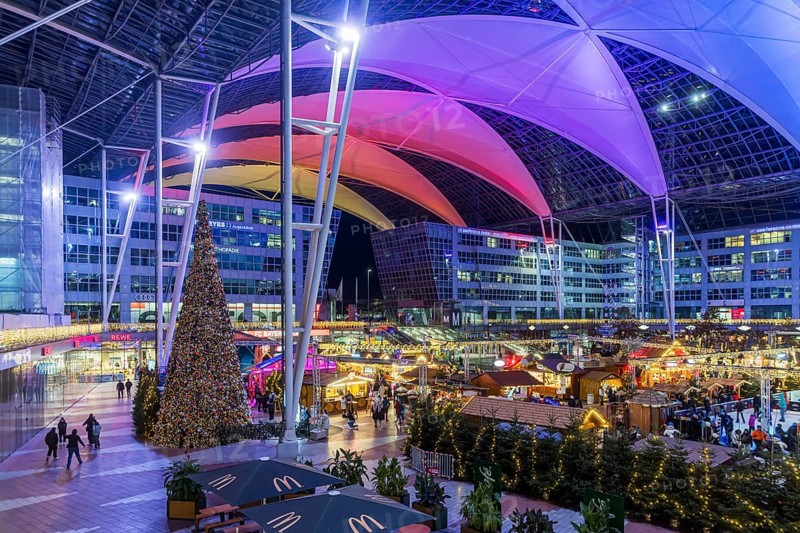 Christmas market at the airport in the evening, market stalls decorated for Christmas in front of the terminal Munich, Bavaria, Germany, Europe