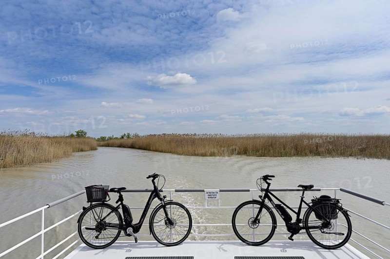 Bicycles on bicycle ferry in the canal, Illmitz, Lake Neusiedl National Park, Seewinkel, Burgenland, Austria, Europe