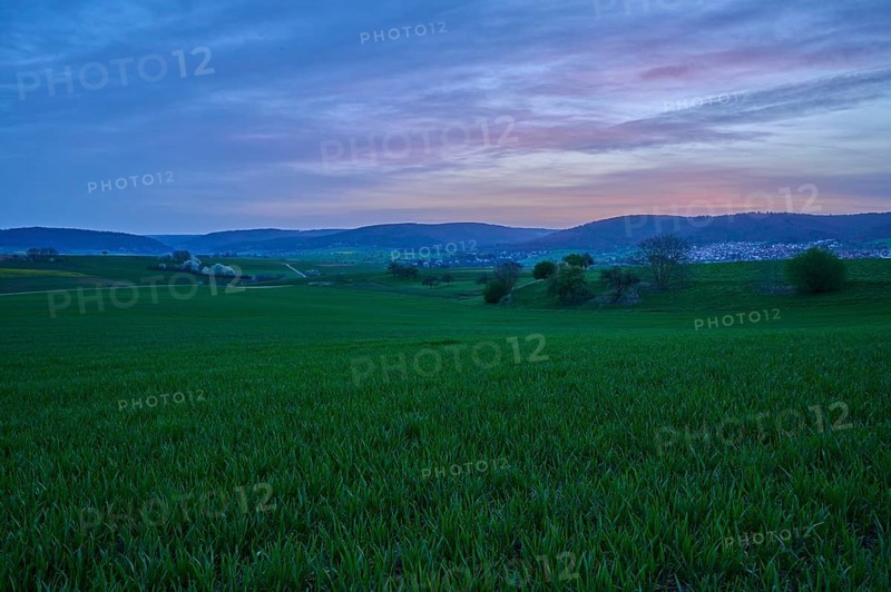 Wide green meadows and hills in the morning light, under a pink-blue sky, Mönchberg, Mltenberg, Spessart, Bavaria, Germany, Europe