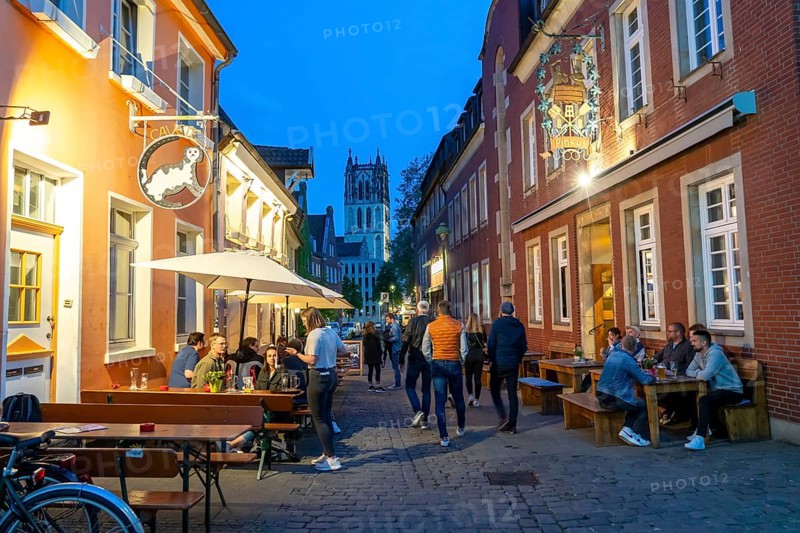 Historic old town, Kuhviertel, pub district, Kreuzstraße, tower of the Liebfrauen-Überwasserkirche, in Münster, North Rhine-Westphalia, Germany, Europe