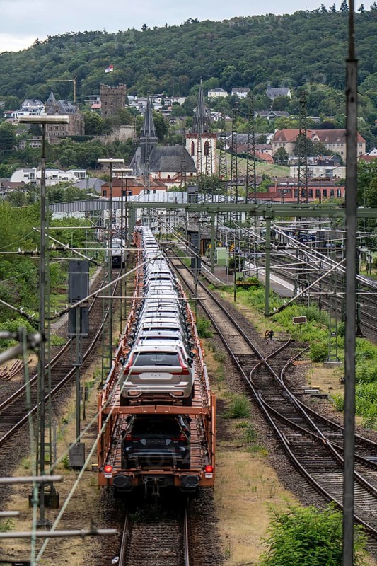 Upper Middle Rhine Valley, goods train, car transporter at Bingen station, waiting for permission to continue its journey, loaded with new Volvo cars, Rhineland-Palatinate, Germany, Europe