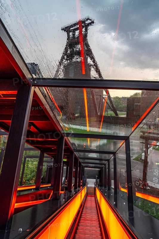 Zeche Zollverein, rainy day, ride on the escalator of the Ruhr Museum, in the coal washing plant, view of the double headframe of shaft XII, through rain-soaked windows, Essen, North Rhine-Westphalia, Germany, Europe