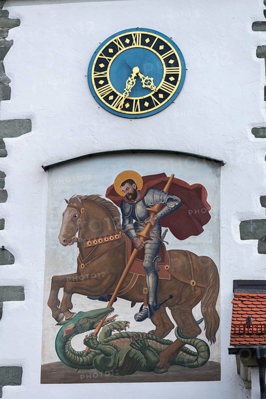 Moated castle, Lake Constance, parish church of St George, church tower clock, church patron saint St George, dragon, horse, riding, Bavaria, Germany, Europe