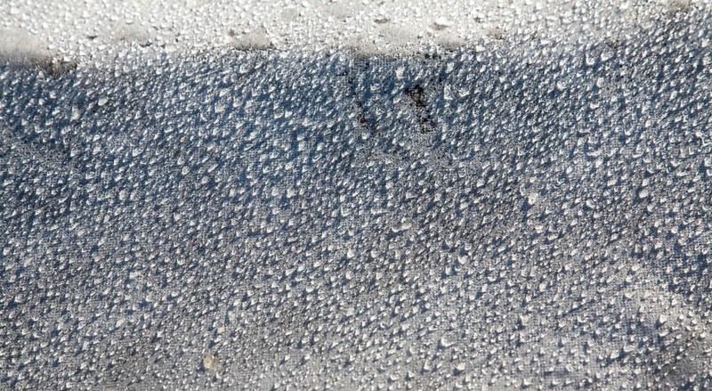 Water droplets dew condensation on fleece fabric in field