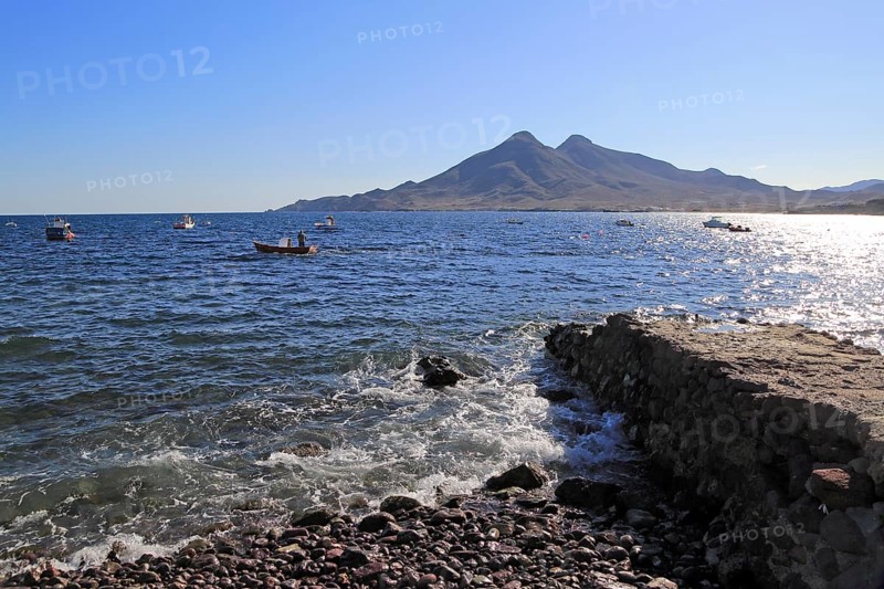 View out to sea and Los Frailes volcanoes from, Isleta de Moro village, Cabo de Gata natural park, Nijar, Almeria, Spain, Europe