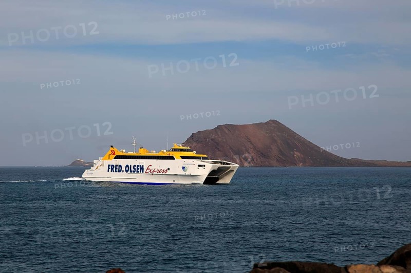 Fred Olsen Express ferry ship passing Los Lobos island, Corralejo, Fuerteventura, Canary Islands, Spain, Europe