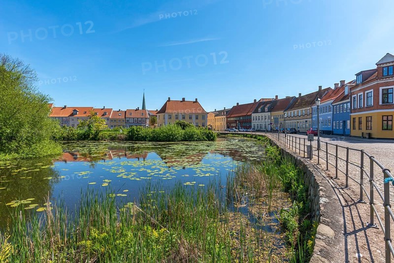 Old town of Nyborg, moat around the medieval town, restored, historic houses, bright colours, water reflection, spring, water lilies, cobblestones, Fyn, Fyn Island, Denmark, Europe