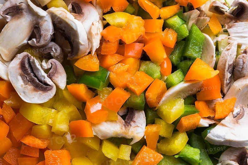 Close-up of diced green, orange and yellow bell peppers, sliced white mushrooms, Studio Composition, Quebec, Canada, North America