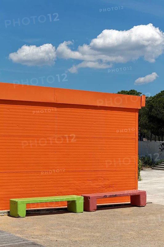 Orange painted house and light green bench, ticket counter, Paleo Falliro, Athens, Attica, Greece, Europe