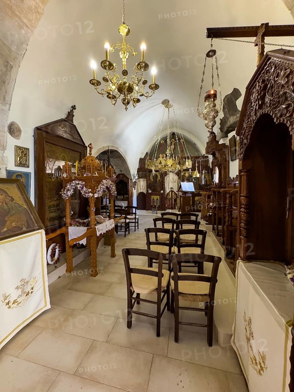 View into the right nave of the two-aisled monastery church dedicated to the Assumption of the Virgin Mary and the Apostles Peter and Paul with large chandelier chandelier in Unesco Site Orthodox Greek Orthodox Monastery of Moni Odigitria, Festos, Crete, Greece, Europe